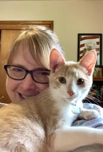 Gouda poses for a selfie with his new human.